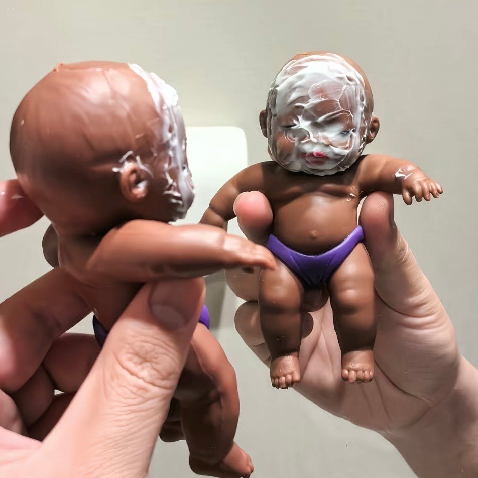 Art Toy Familia Natasha Squeeze Toy — two dolls with cream-covered faces, prank-style shot