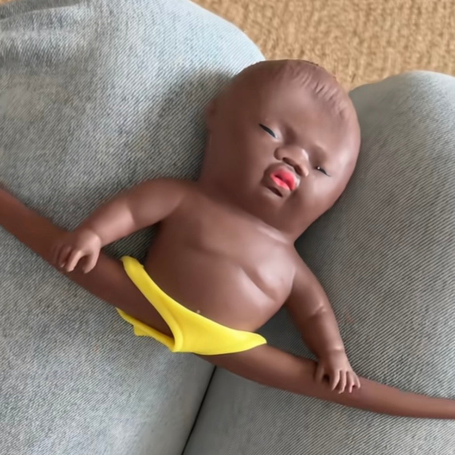 Art Toy Familia Natasha Squeeze Toy — lying pose with arms out, yellow underwear